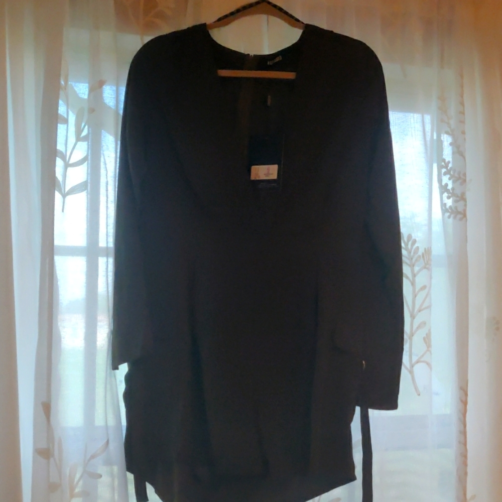 One piece short outfit . Brand is "Misguided" chest area low cut v neck   sexy.